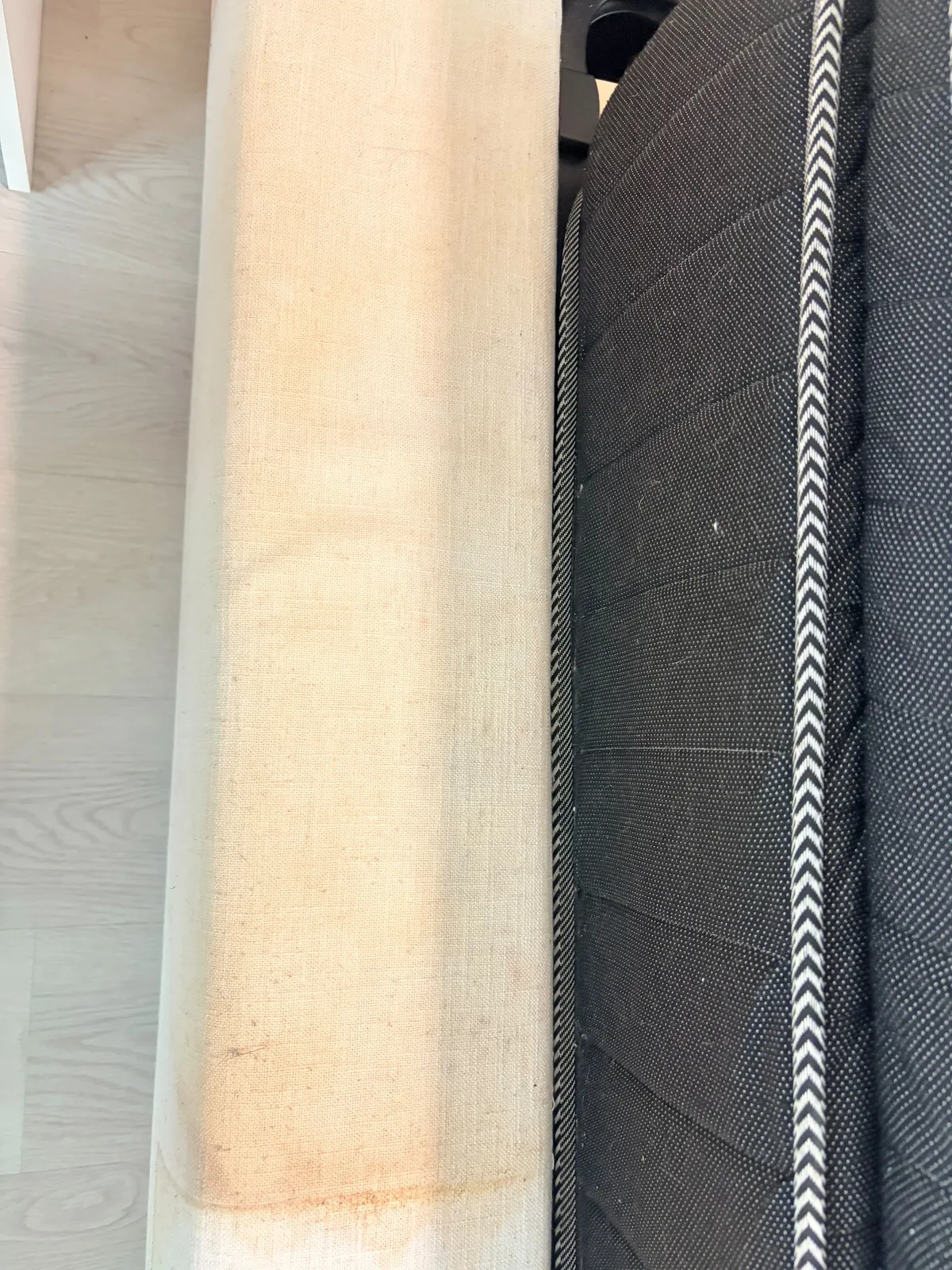 Mattress before deep cleaning โ close-up of stained upholstered edge