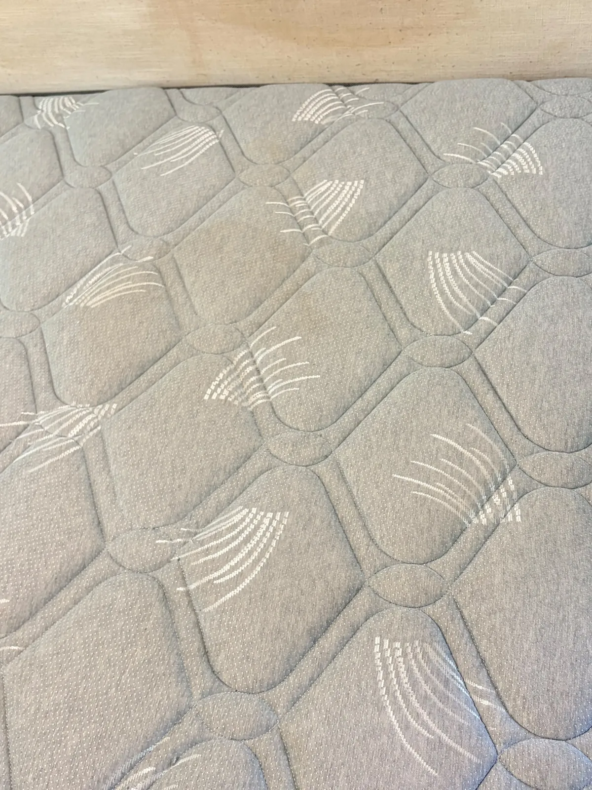 Mattress before deep cleaning โ dust and marks across the surface