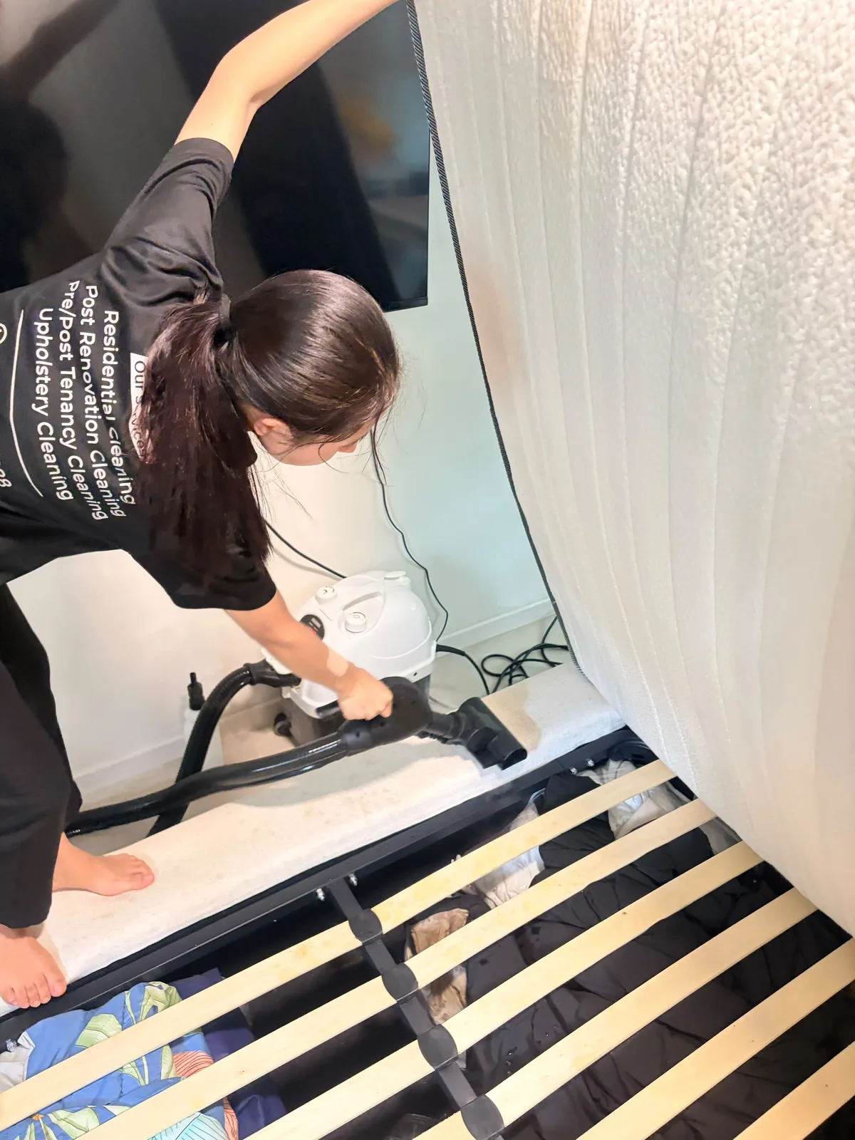 Mattress deep cleaning โ bed base vacuumed with mattress lifted