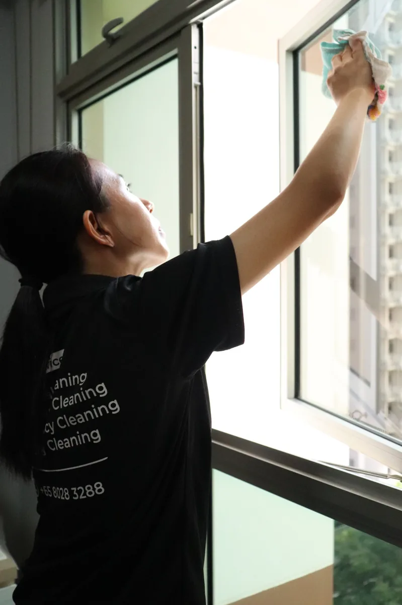 Window cleaning — reaching up with cloth