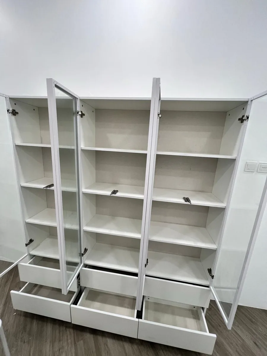 Full cabinet unit — all doors and drawers opened, interiors wiped clean