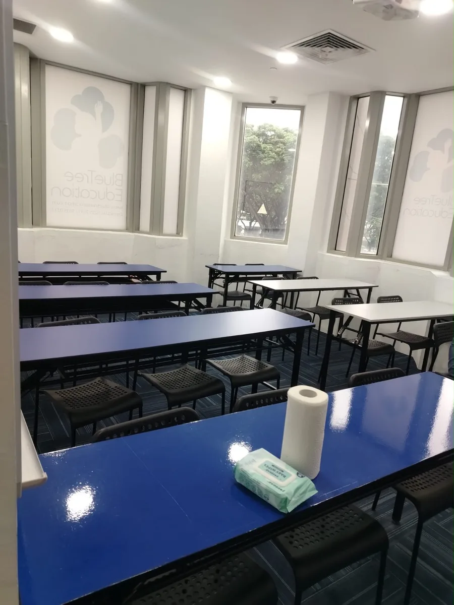 Office cleaning result — Blue Tree Education classroom, tables polished and floor immaculate
