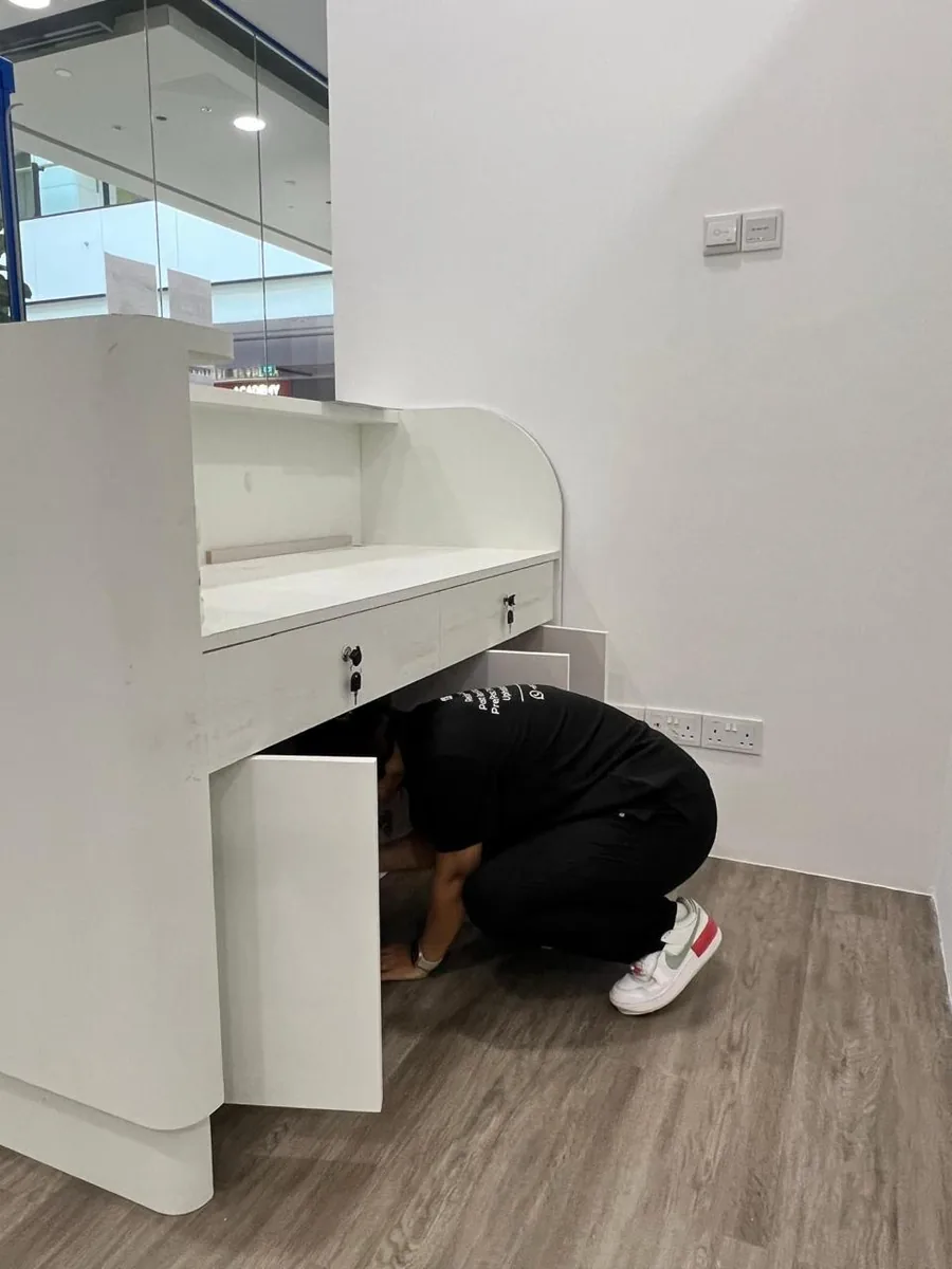 Reception desk deep clean — under-counter and drawer areas
