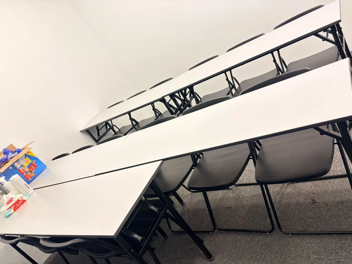 Office cleaning result — large training hall, spotless tables and clean carpet