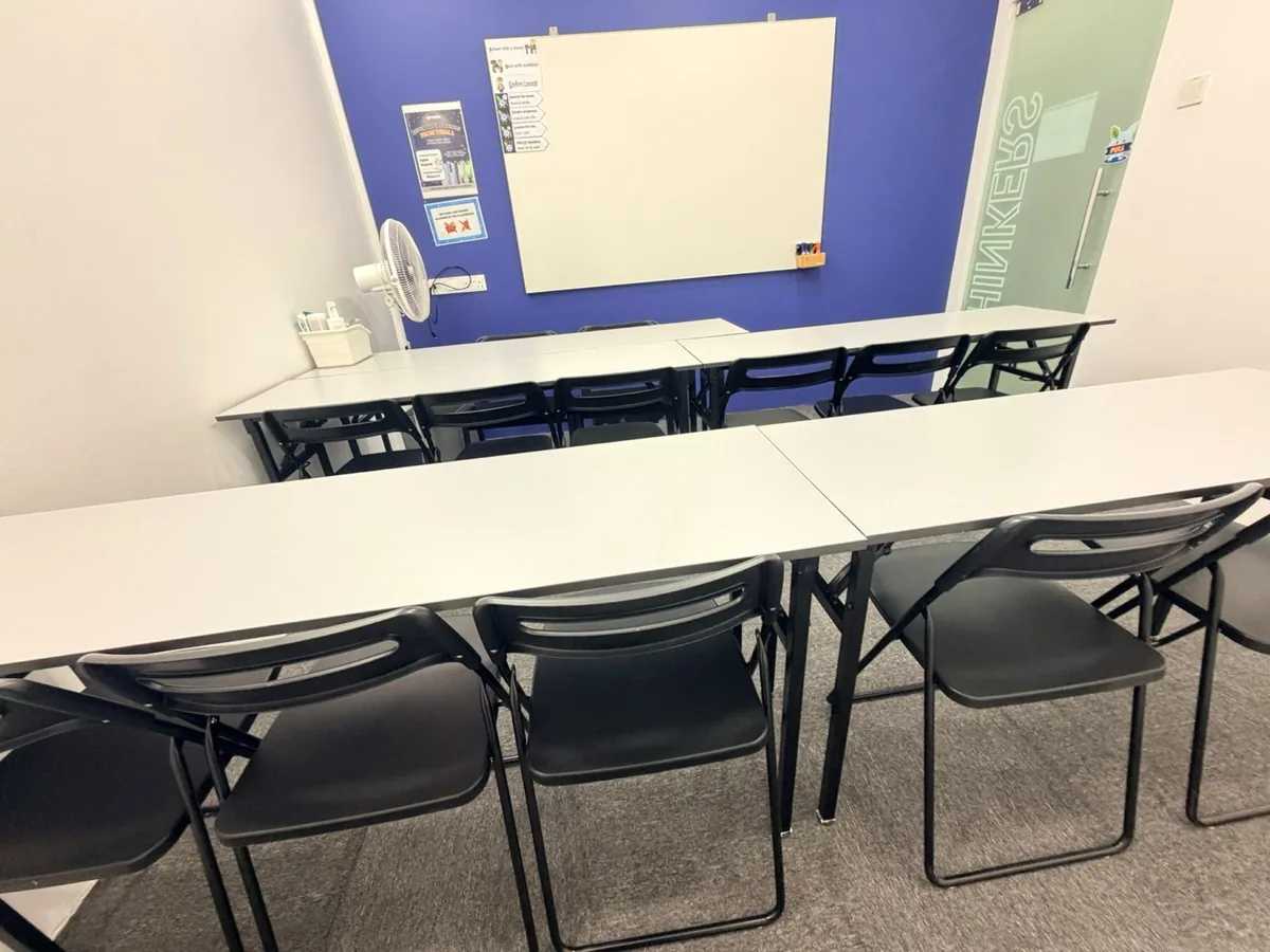 Office cleaning result — training room tables wiped, floor cleaned, whiteboard fresh