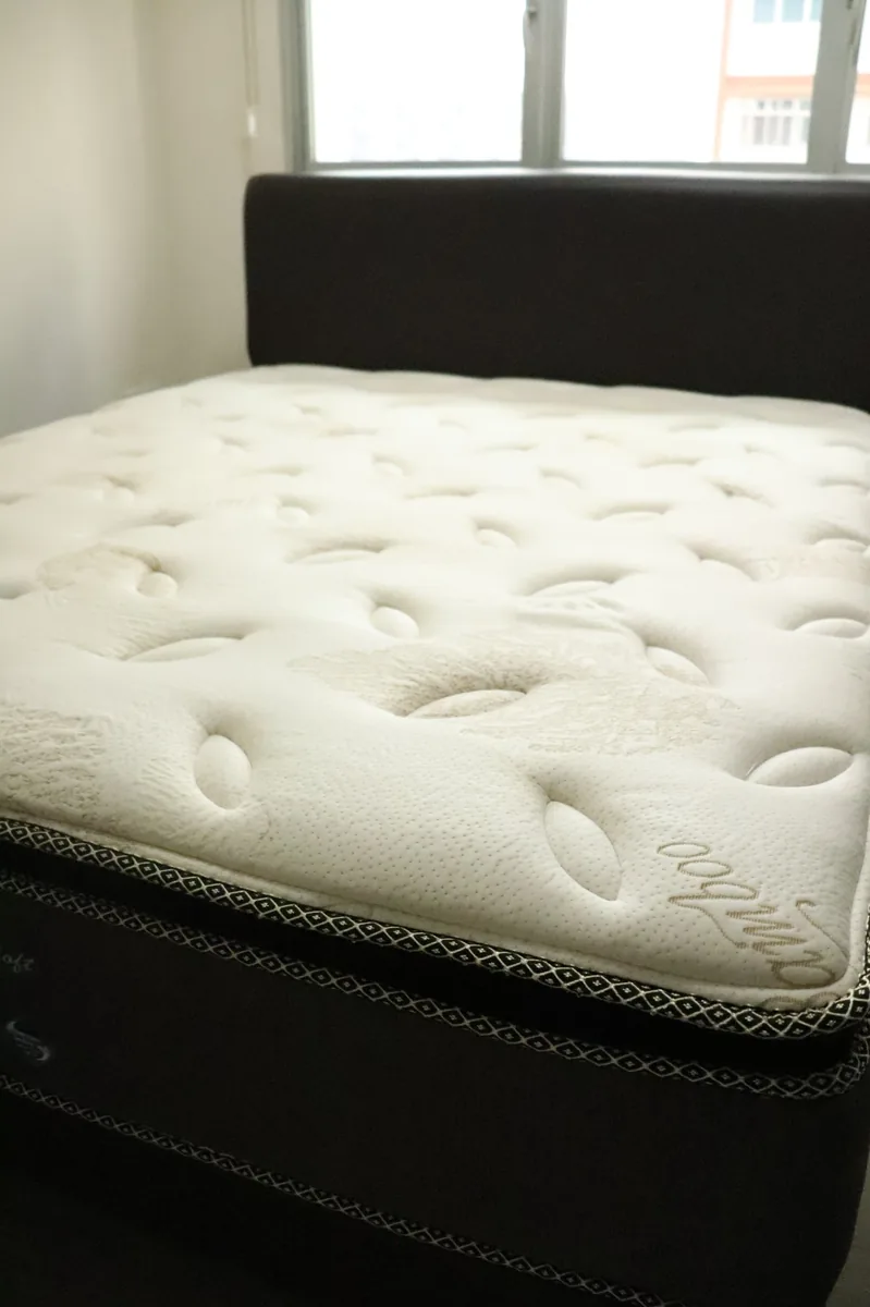 Mattress before deep cleaning — showing wear and hidden buildup